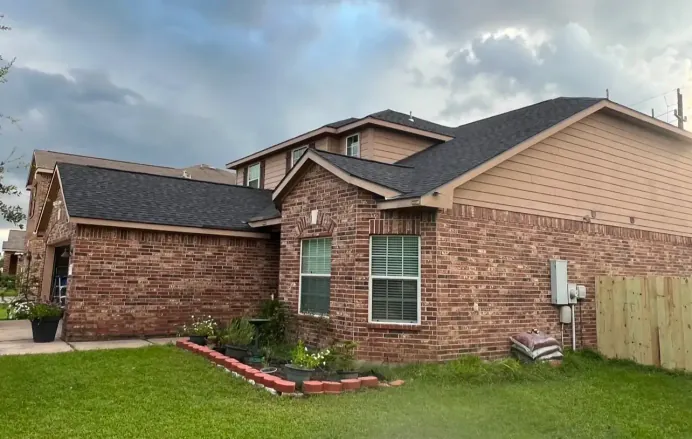 Completed roof replacement, street-level view, Houston, TX