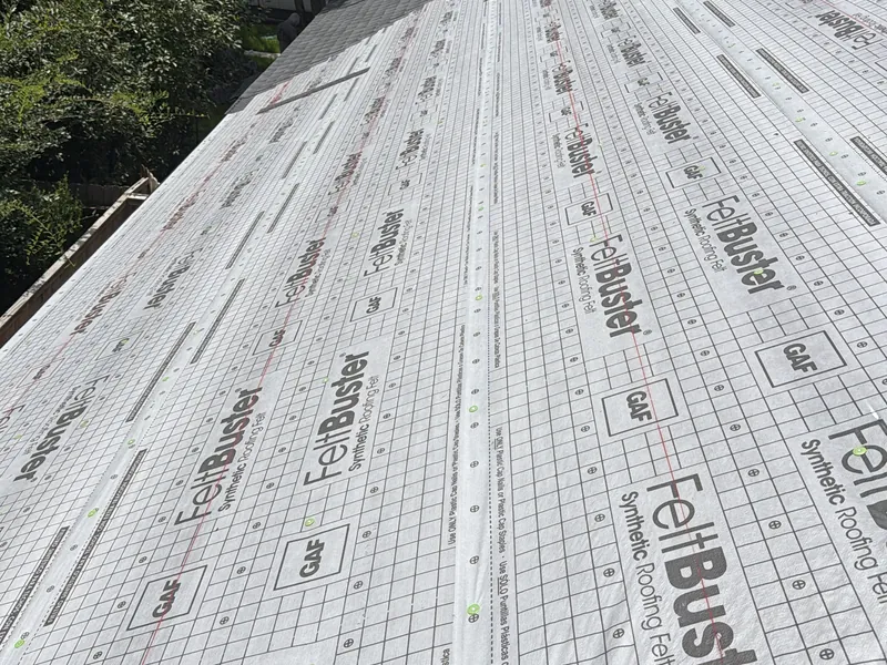 Roof slope covered with GAF FeltBuster synthetic roofing felt before the new shingles go on