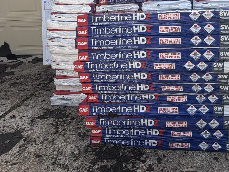 Bundles of GAF Timberline HDZ shingles in Charcoal delivered for a 3 S Roofing roof replacement