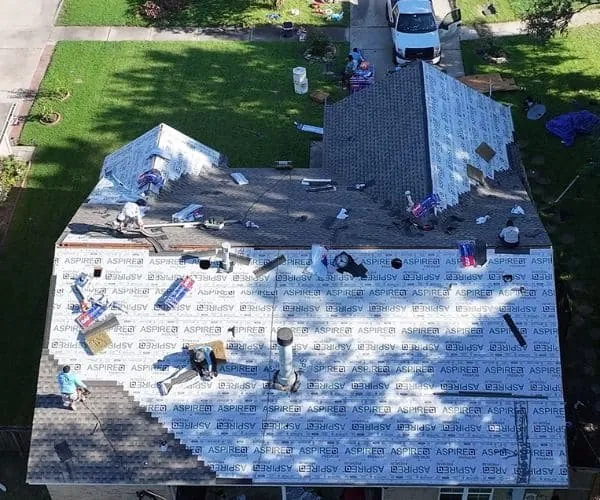 3 S Roofing crew installing a new roof, drone view, Houston, TX