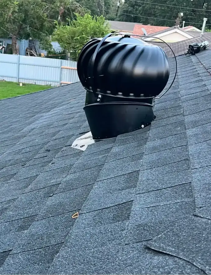 Close-up of a roof ventilation turbine installed during a roofing job, Houston, TX
